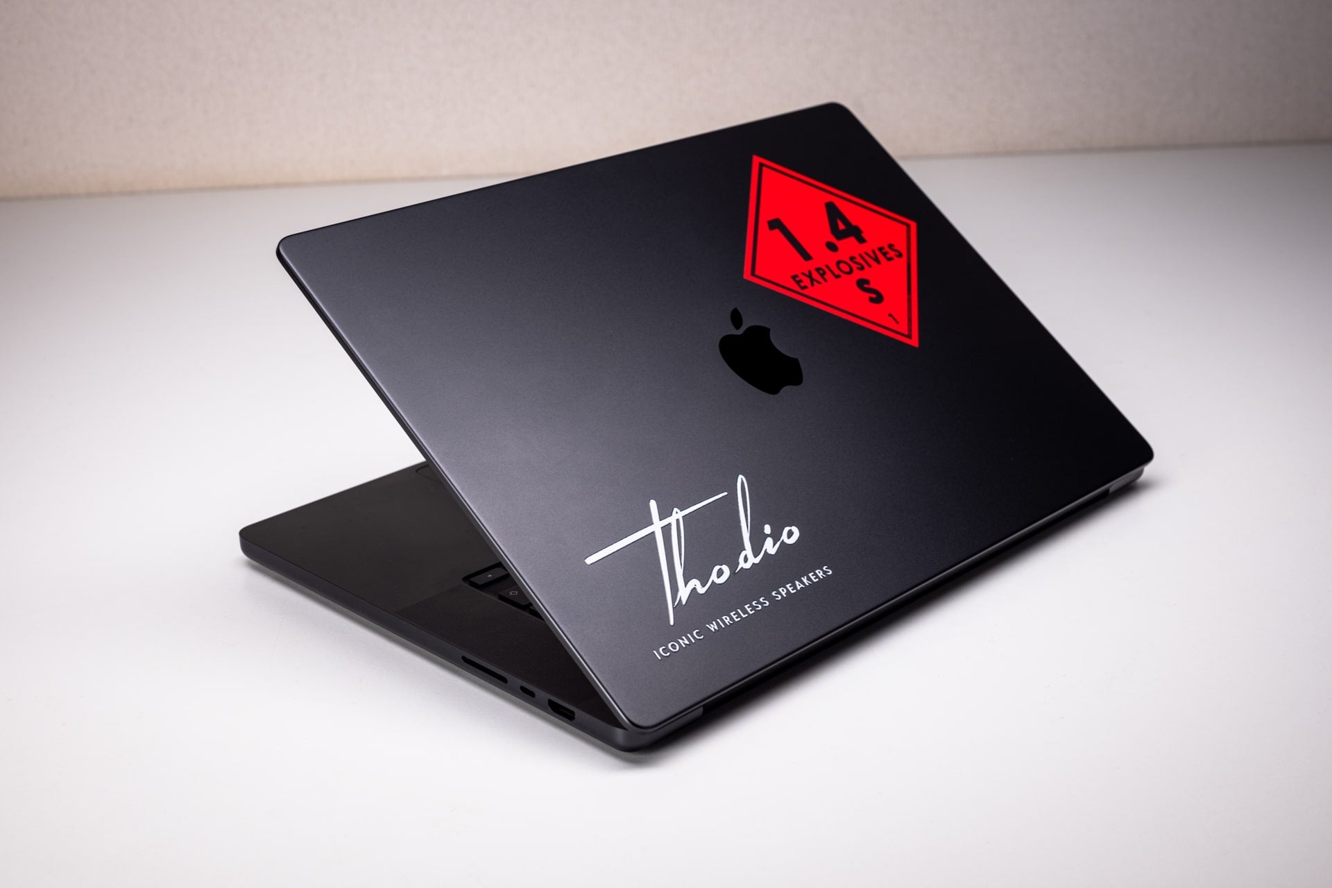 laptop with a black Thodio sticker