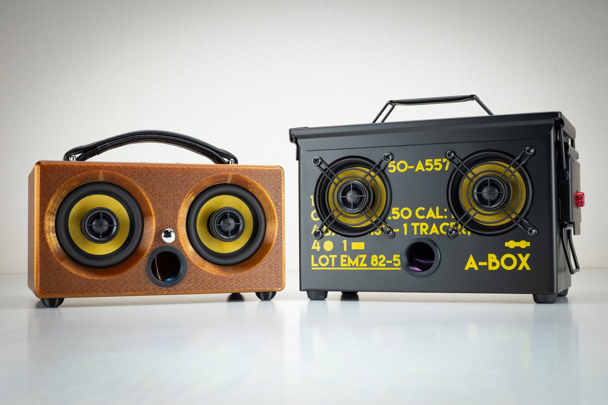 Amber Thodio iBox Mini 3D-printed Bluetooth speaker beside the .50 cal ammo can A-BOX speaker for comparison