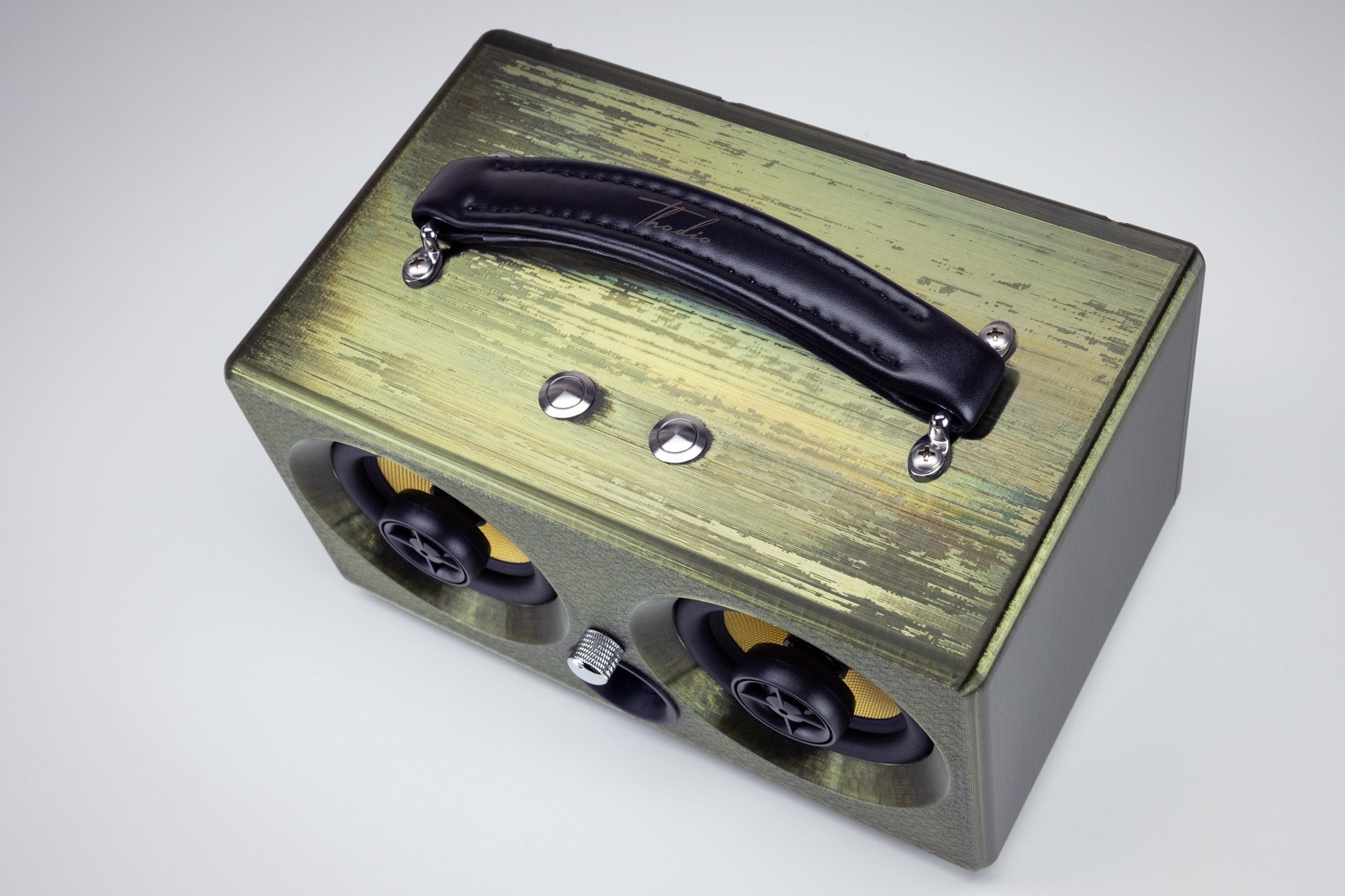 Top view of the emerald Thodio iBox Mini 3D-printed Bluetooth speaker with padded leather carry handle and chrome control buttons