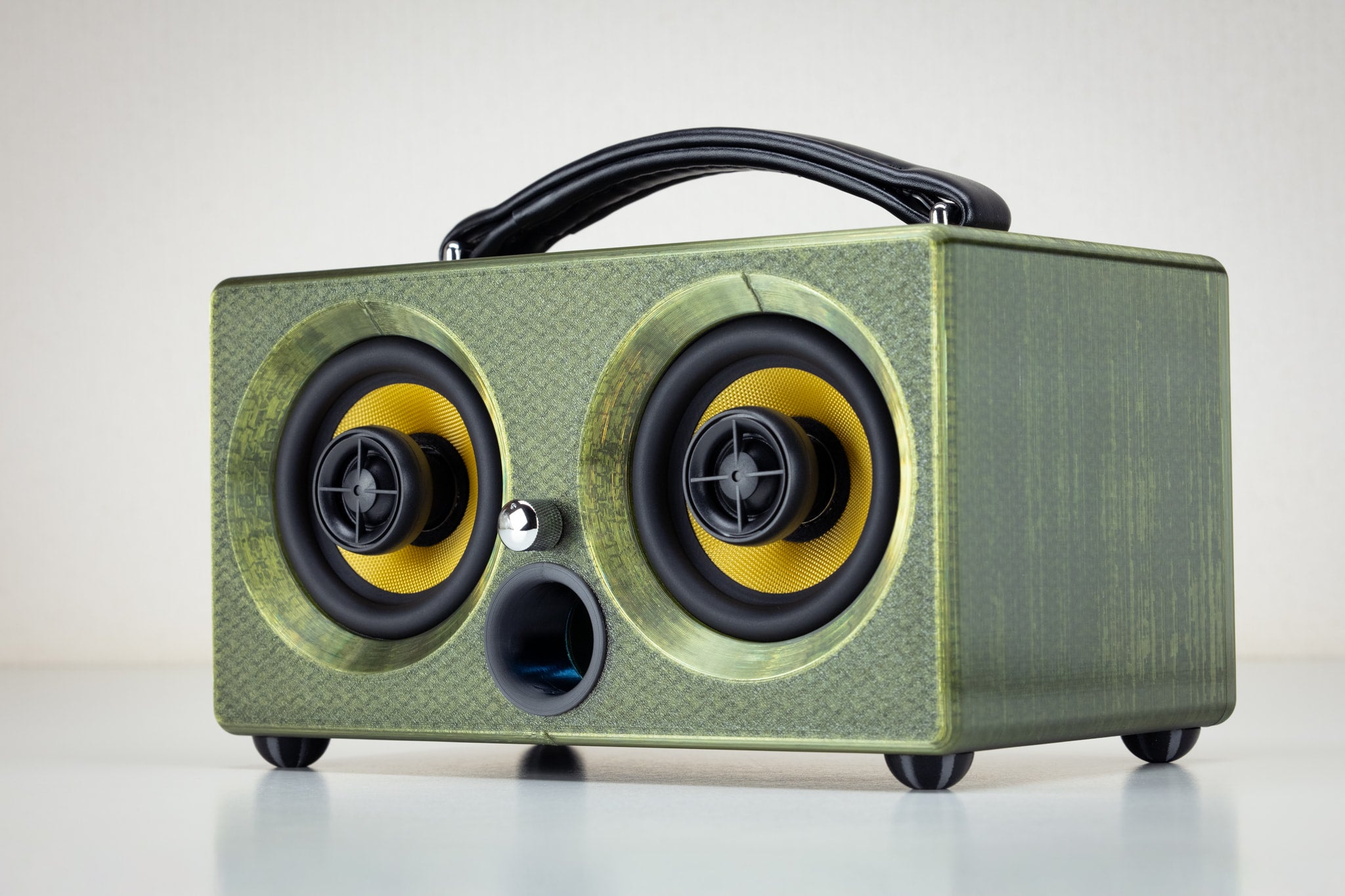 Thodio iBox 3D-printed wireless Bluetooth speaker in forest green, angled front view with carry handle